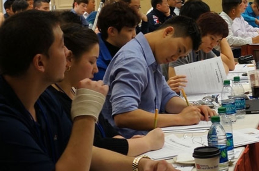 martial arts business marketing seminar attendees taking notes